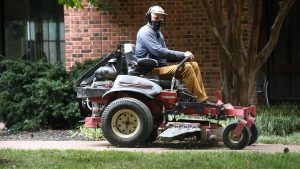 Man on lawnmower