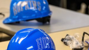 Two blue Hopkins hard hats